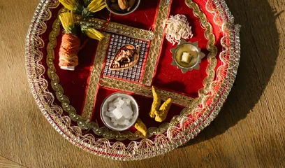 Bhai Dooj: a decorated puja thali with a diya, roli and sweets