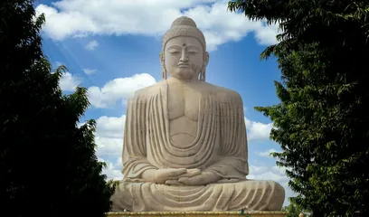 Buddha Purnima: a large stone statue of the Buddha seated in meditation