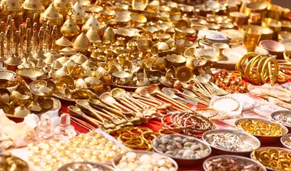 Dhanteras: rows of new brass and steel utensils