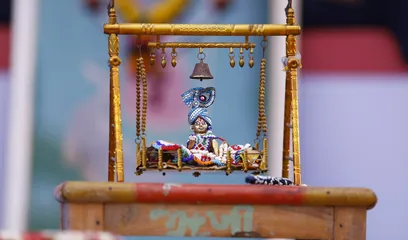 Krishna Janmashtami: baby Krishna in a decorated jhula