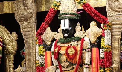 Narasimha Jayanti: a Vishnu idol adorned with garlands in a temple