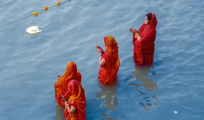 Ratha Saptami: women standing in a river to offer arghya to the Sun