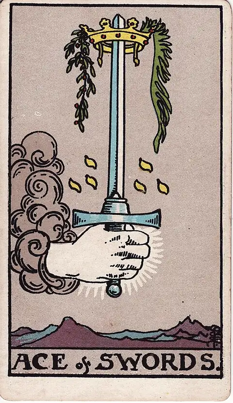 Ace of Swords. A hand comes out of a cloud gripping an upright sword crowned with a wreath and two branches, over jagged mountains.