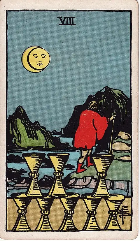 Eight of Cups. A cloaked man walks away over rocky ground towards mountains under an eclipsed moon, leaving eight cups stacked behind him.