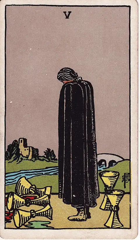 Five of Cups. A cloaked figure looks down at three spilled cups, not seeing the two still standing behind, with a bridge and a house across the river.