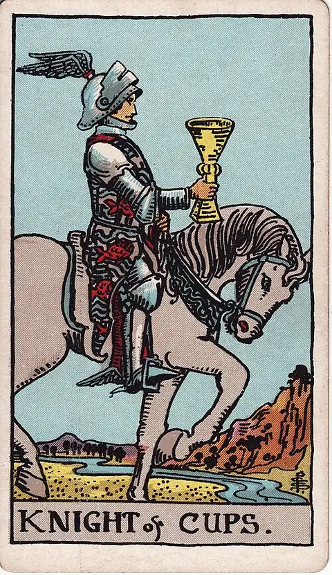 Knight of Cups. A winged-helmeted knight rides a walking white horse, holding a cup out before him, a river crossing the dry land ahead.
