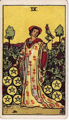 Nine of Pentacles. A richly dressed woman stands alone in a walled vineyard with a hooded falcon on her gloved hand, nine pentacles among the vines.