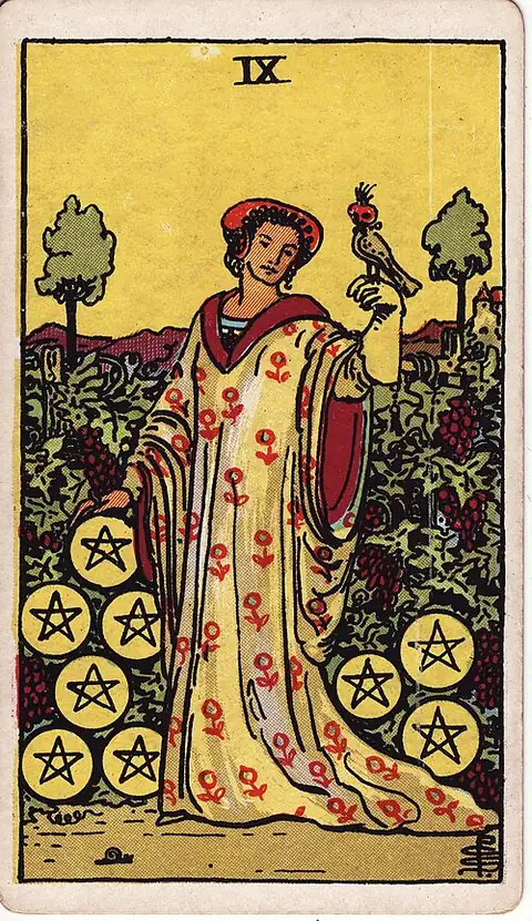 Nine of Pentacles. A richly dressed woman stands alone in a walled vineyard with a hooded falcon on her gloved hand, nine pentacles among the vines.