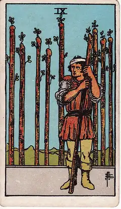 Nine of Wands. A bandaged man leans on a staff, watching, with eight more staves standing like a fence behind him.