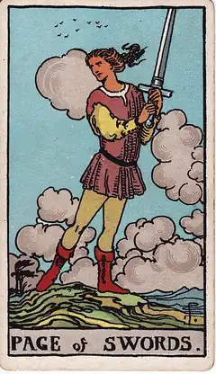 Page of Swords. A young figure stands on high ground holding a sword upright in both hands, hair and clouds blown by wind, looking back over the shoulder.