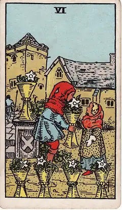 Six of Cups. A child hands a cup of white flowers to a smaller child in a walled courtyard, four more flower-filled cups around them.