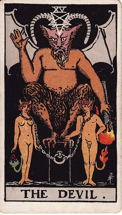 The Devil. A horned figure squats on a block above a naked man and woman loosely chained to it by the neck, both grown small horns and tails.