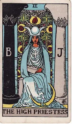 The High Priestess. A veiled woman sits between a black pillar and a white one, a crescent moon at her feet and a half-hidden scroll in her lap.